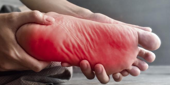 a foot writhing in pain and discomfort