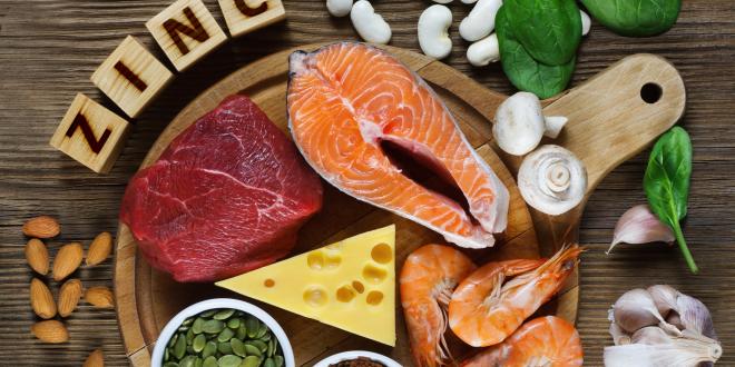 A platter of zinc-rich foods, including red meat, cheese, seafood and pumpkin seeds.