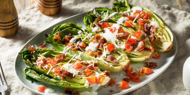 Romain lettuce with toppings on it. 